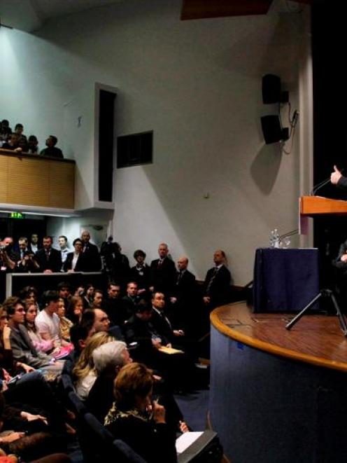 Russian President Dmitry Medvedev, right, delivers a speech to the London School of Economics, in...