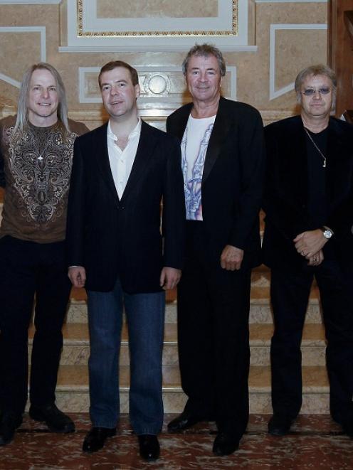 Russian President Dmitry Medvedev, third left, poses with Deep Purple members, from right,...