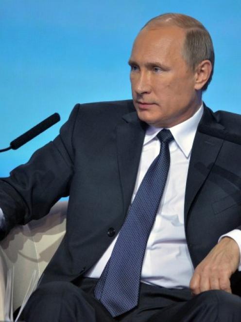 Russian President Vladimir Putin attends a meeting with his core support group, the People's...