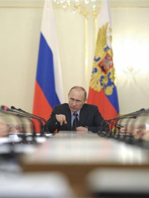 Russian President Vladimir Putin chairs a Russian Government meeting  near Moscow last week. Mr...