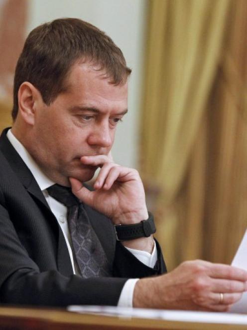 Russian Prime Minister Dmitry Medvedev chairs a government session at the Russian White House,...