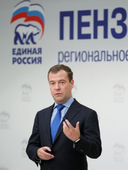 Russian Prime Minsiter Dmitry Medvedev gestures while speaking during a meeting with activists of...