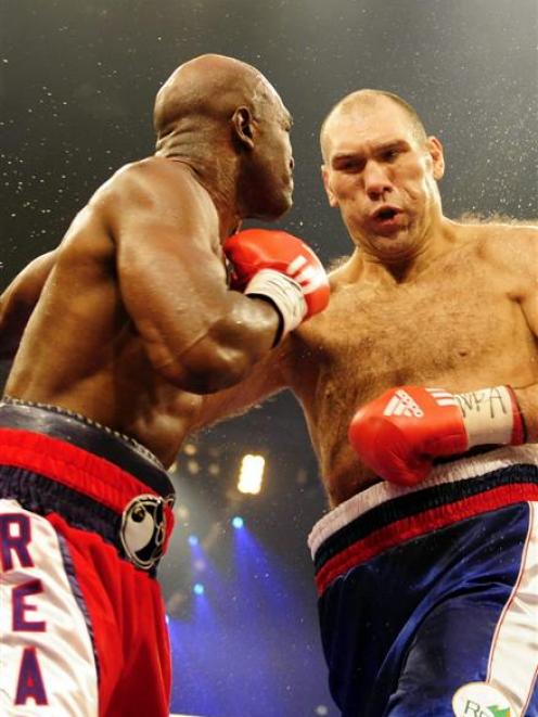Russian WBA heavyweight champion Nikolai Valuev, right, and Evander Holyfield from the United...