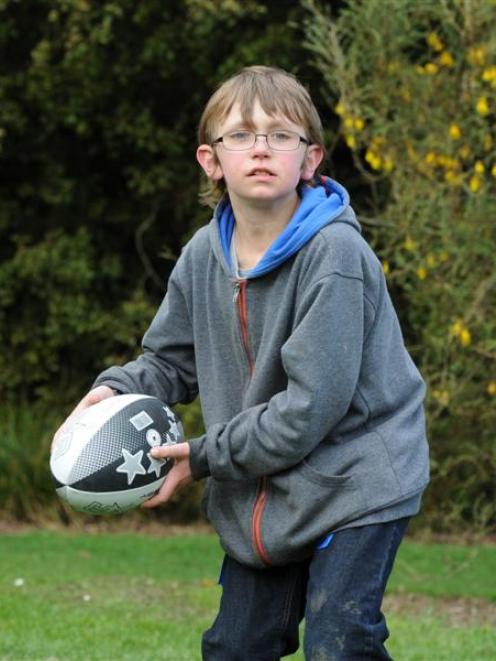 Ryan Box (12), of Dunedin, plays Rippa rugby at the Operation New Direction sports club  launch...