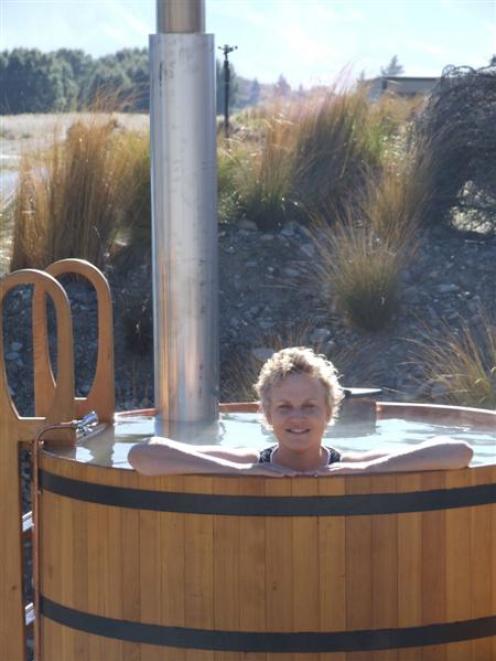 Sally Rae tries out one of the hot tubs.