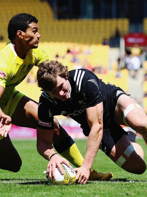 Sam Dickson of New Zealand dives over to score a try during the match between New Zealand and...