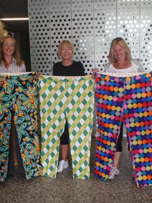 Sam Gent, who manages The Hills, holds up some of the Loudmouth pants she has ordered from the...