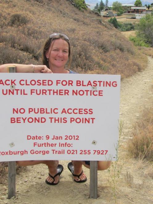 Samantha Rule, of Clyde, cannot run on this track because of blasting work. This sign is at the...