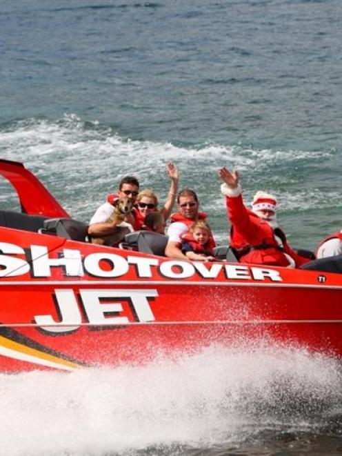 Santa Claus enjoys a joyride before going on stage at last year's Shotover Jet Remarkable...
