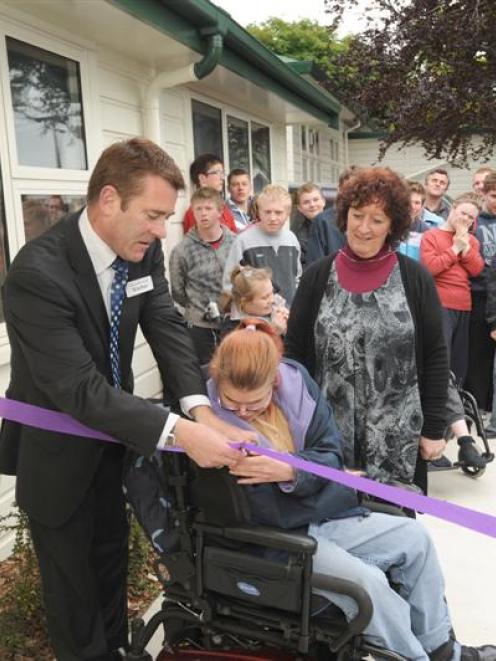 Sara Cohen School pupil Karena Robinson officially opens the school's refurbished administration...