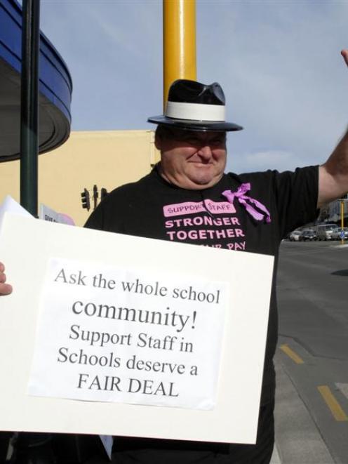 Sara Cohen School teacher aide Lloyd Agnew takes part in the protest. Photo by Gregor Richardson.