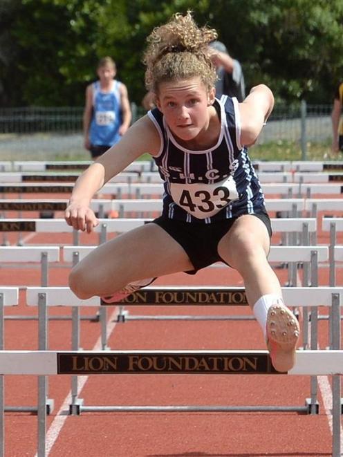 Sarah Langsbury, of St Hilda’s Collegiate School, wins the girls’ under-14 80m hurdles at the...