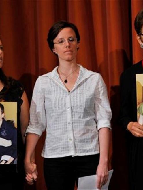 Sarah Shourd (centre), stands with Cindy Hickey (left), mother of Shane Bauer, and Laura Fattal,...