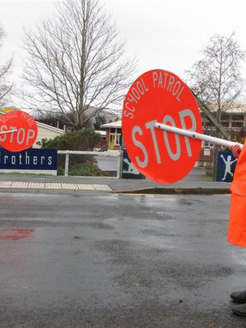 Sawyers Bay School principal Gareth Swete (left) and school patrollers Ethan Aitcheson (9) and...