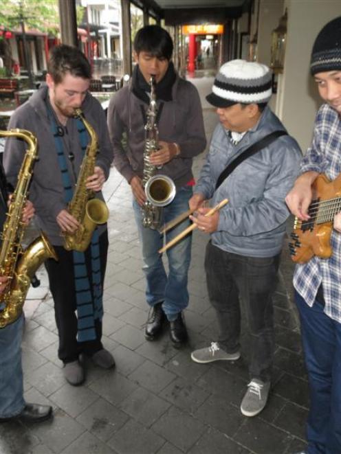Saxophonist Dr Jason Thornton (left), of Queenstown, jams with (from left) saxophonist Jimmy...