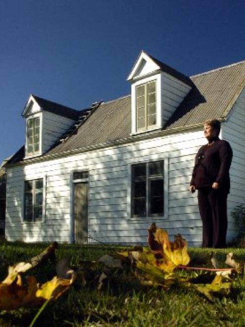 Real estate agent Nicky Oliver outside the old Waikouaiti school house, first opened in 1860....