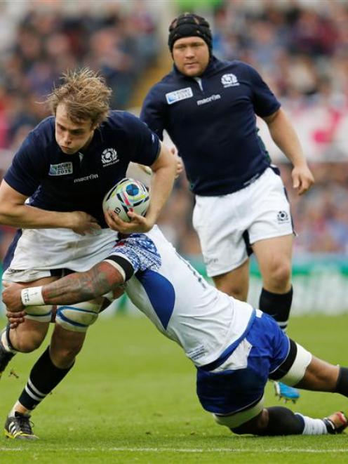 Scotland lock Jonny Gray carries the ball against Samoa. Photo: Reuters