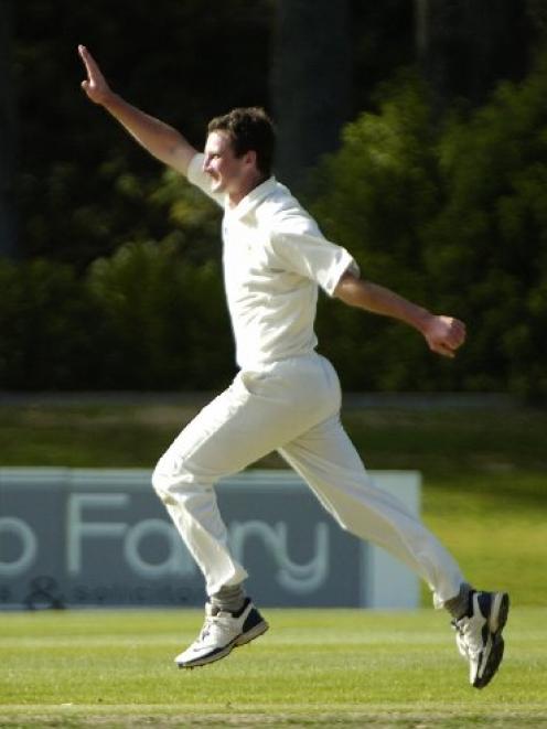 Otago left-armer Bradley Scott celebrates taking the wicket of Wellington batsman Michae Parlane...