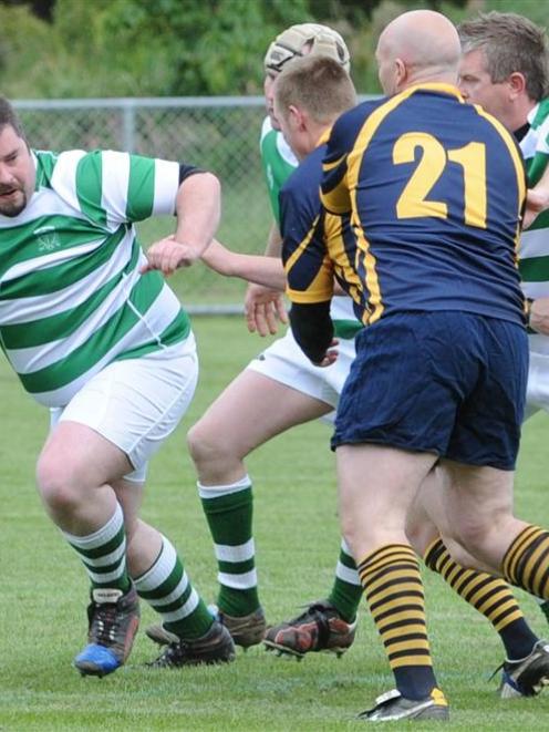 Scott Guthrie takes the ball up at a rugby match held yesterday at Watson Park in Port Chalmers...