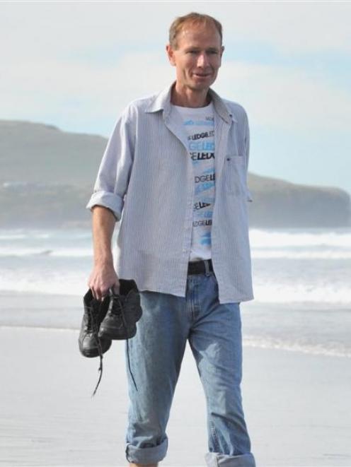 Sean Davison walks on St Clair Beach, Dunedin, after completing his  home detention sentence....