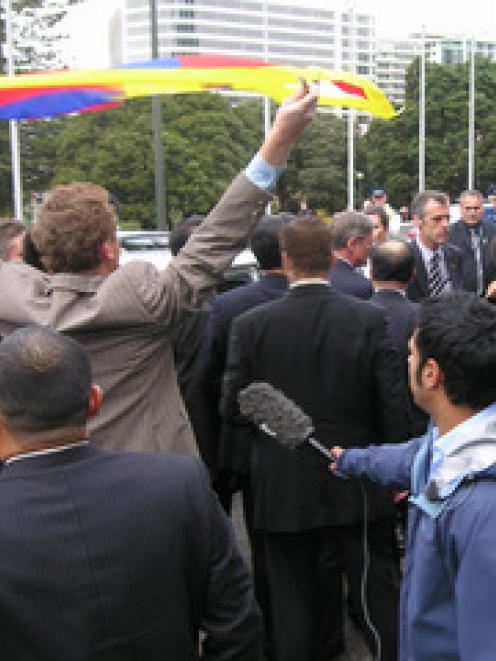 Greens co-leader Russel Norman flies the Tibetan flag as China's Vice President Xi Jinping...