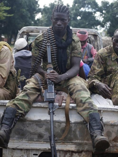 Seleka fighters take a break as they sit on a pick-up truck in the town of Goya. Photo by Reuters