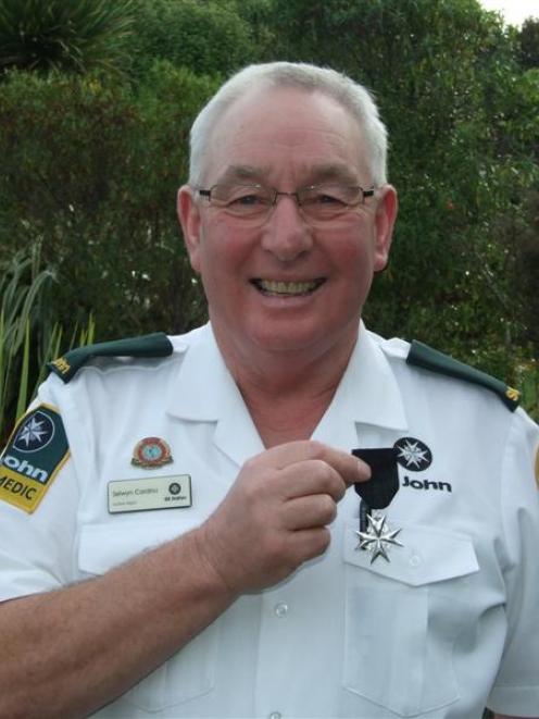 Selwyn Cardno, of Kaka Point, proudly displays his Order of St John medal. Photo by Helena de Reus.