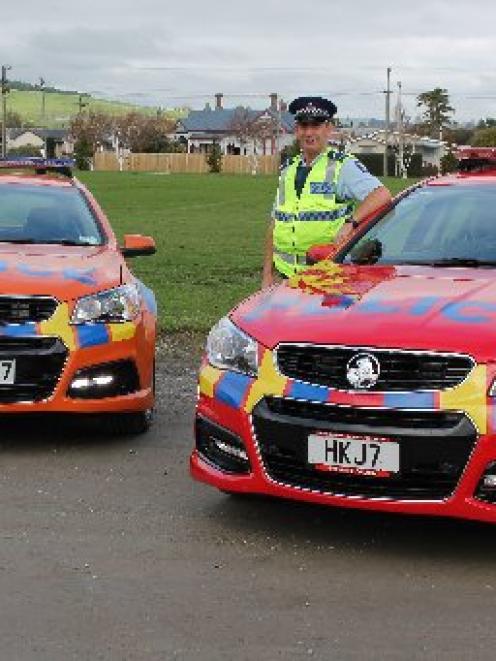 Senior Constable Graeme Buttar, of Central Otago Highway Patrol,  with the two new coloured...