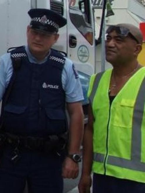 Senior Constable Mike Colligan and truck driver Vincent Pirikahu with Mr Pirikahu's vehicle....