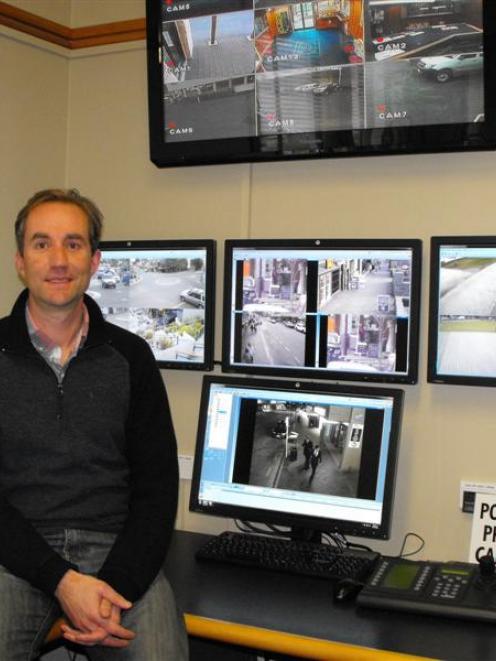 Senior Constable Sean Drader, of  Queenstown,   with  the  CCTV system  he says is     preventing...
