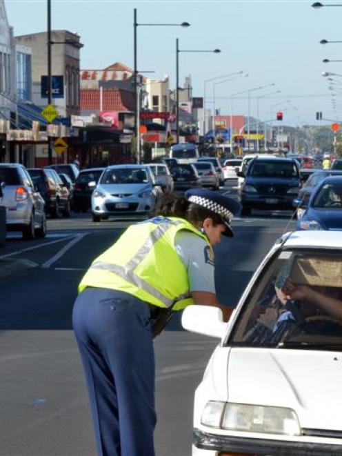 Senior Constable Toni Wall talks to the driver of a vehicle on King Edward St, South Dunedin,...