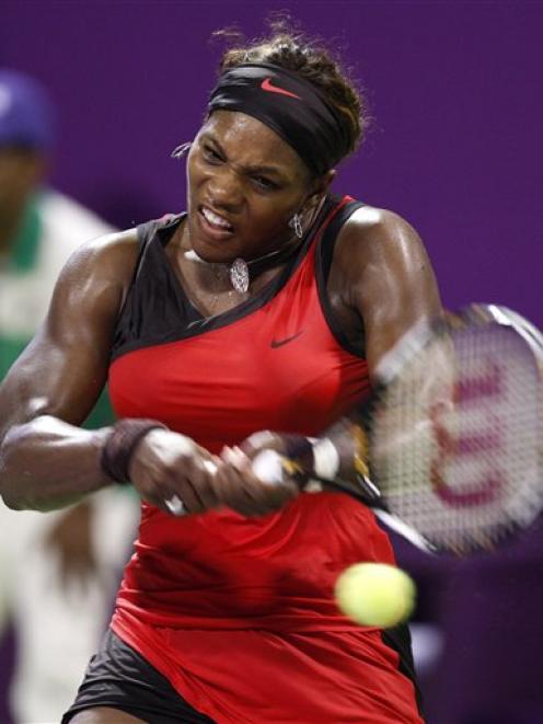 Serena Williams of the United States returns a ball to Svetlana Kuznetsova of Russia during their...