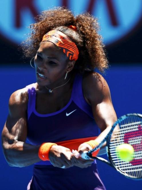 Serena Williams of the US hits a return to Edina Gallovits-Hall of Romania during their women's...