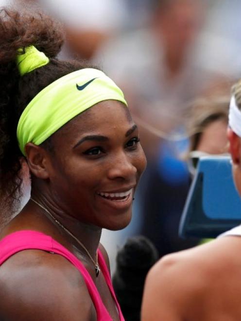 Serena Williams of the US talks to Andrea Hlavackova of the Czech Republic after their women's...