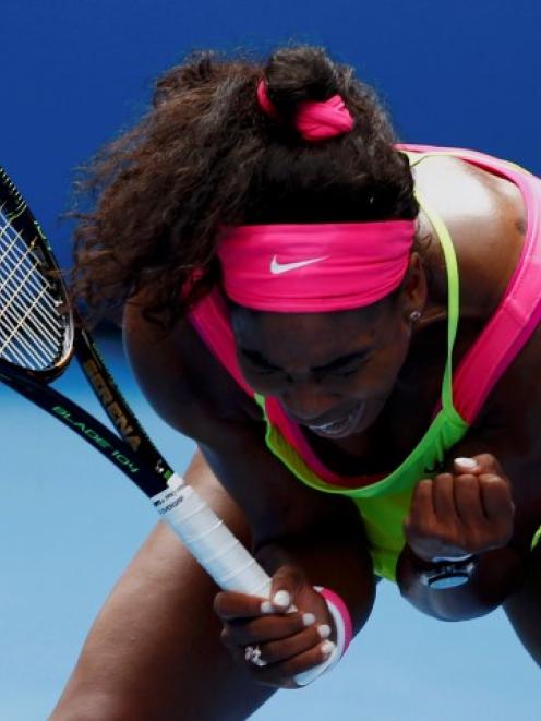 Serena Williams reacts after winning a point against Garbine Muguruza. REUTERS/Issei Kato