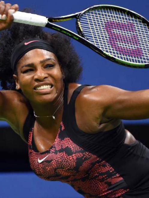 Serena Williams returns the ball to sister Venus in their quarterfinal showdown at the US Open....