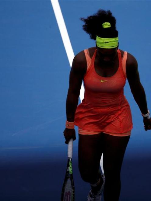 Serena Williams walks into a shadow during her semifinal loss to Roberta Vinci. Photo: Reuters.