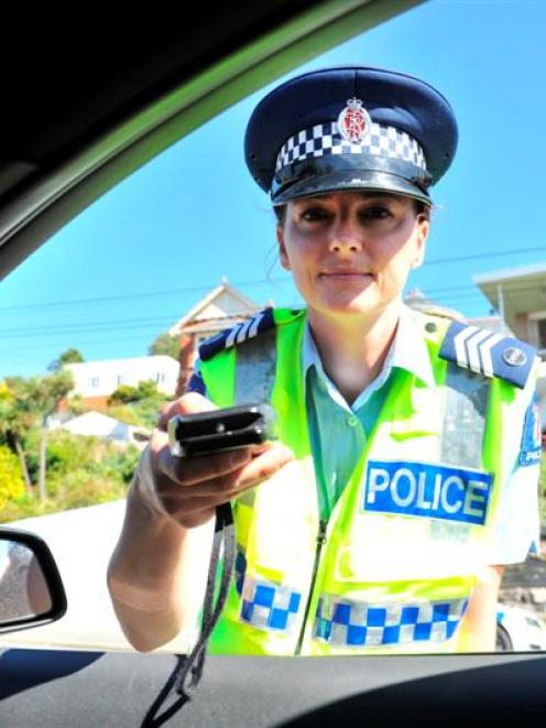 Sergeant Tania Baron, in charge of the Dunedin strategic traffic unit, breath-tests drivers at a...