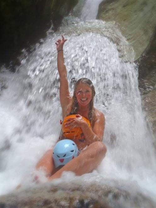 Serious Fun River Surfing guide Anna Moresby poses for the Christchurch earthquake calendar...