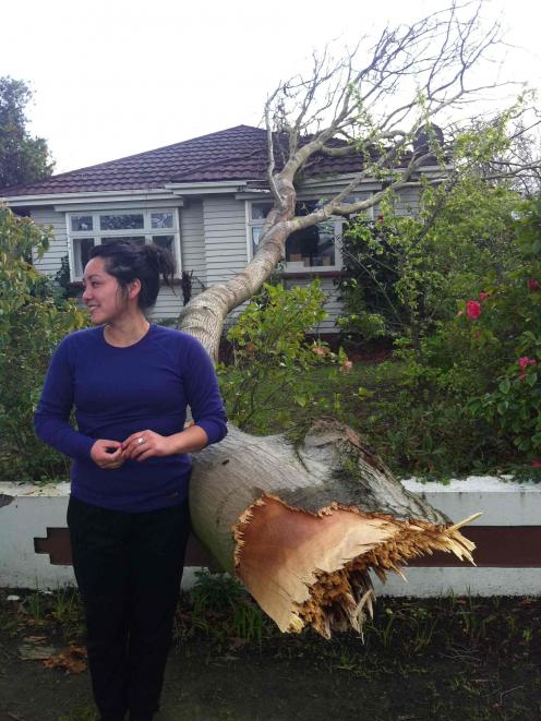 Shannon Swann outside her Christchurch house which was struck by a tree in last night's storm....