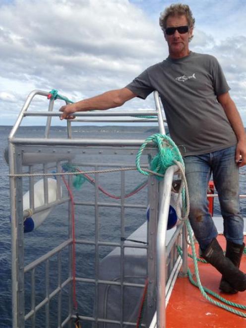 Shark Dive NZ director Peter Scott, of Dunedin, does not believe cage diving is encouraging...