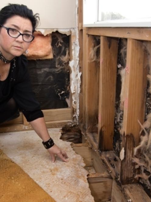 Sharon Leigh in one of the water-damaged rooms in her house. Photo / NZ Herald.