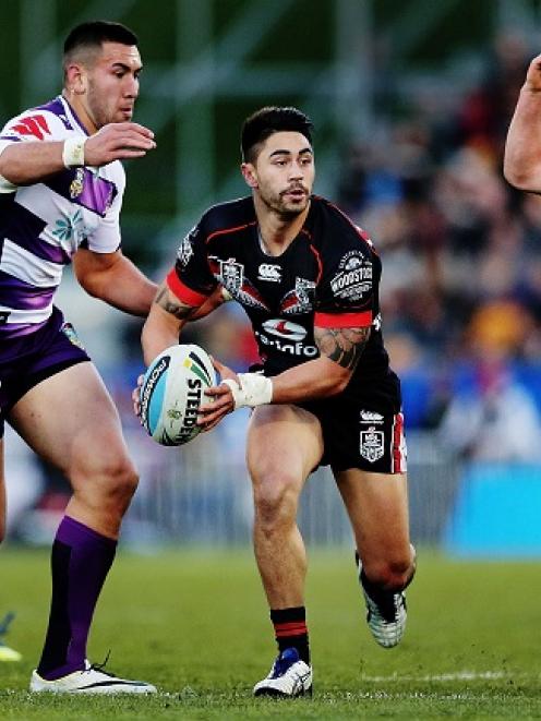 Shaun Johnson looks to distribute for the Warriors against the Melbourne Storm.