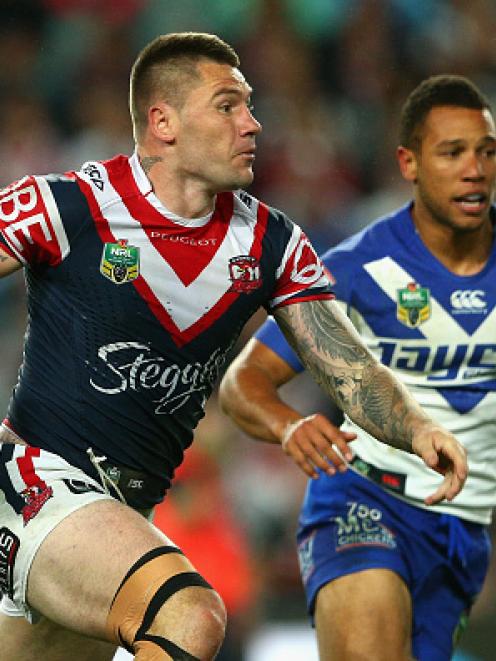 Shaun Kenny-Dowall runs the ball up against the Bulldogs.  Photo Getty