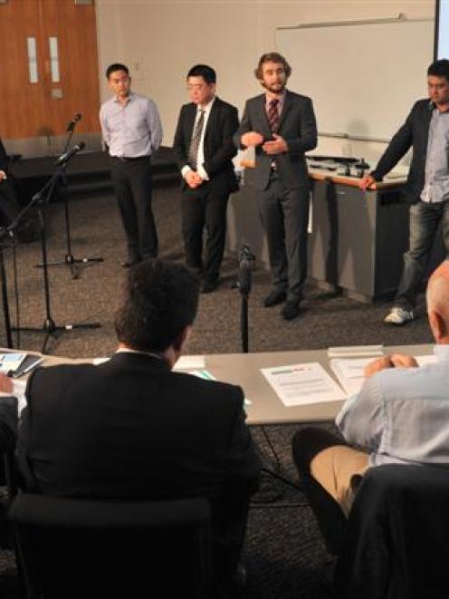 Shogo Tanaka (left), Gabriel Kou, Ben Alder and Luiz Uehara answer questions from judges Kereyn...