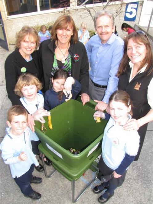 Showing how they are using the hotel's donated worm farm are Queenstown Primary School pupils ...