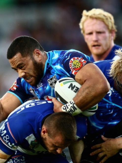 Siliva Havili of the Warriors is caught by the Bulldogs defence. Photo Getty Images