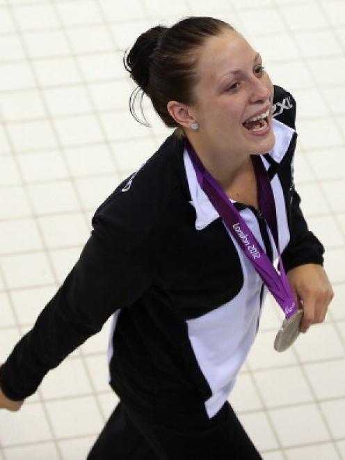 Silver medallist Sophie Pascoe of New Zealand celebrates with her medal after competing in the...