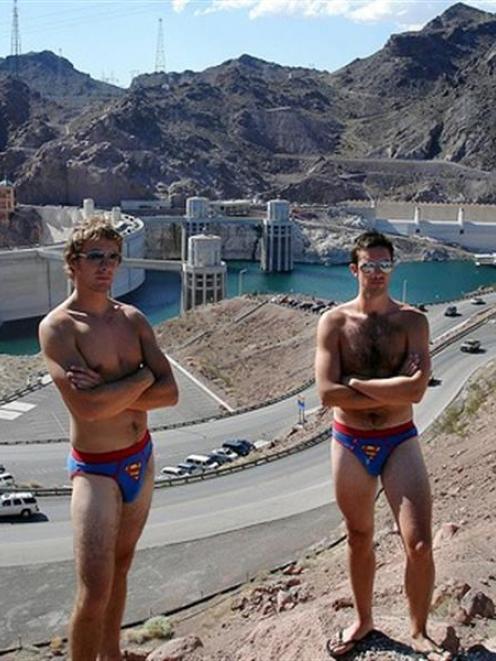 Simon Guild and John Johnston model their "supies" in front of the Hoover dam in the United States.