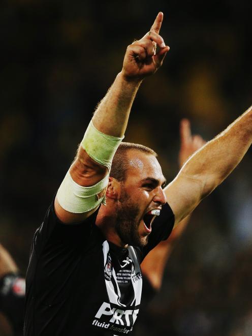 Simon Mannering of New Zealand celebrates winning the Four Nations Final between the New Zealand...